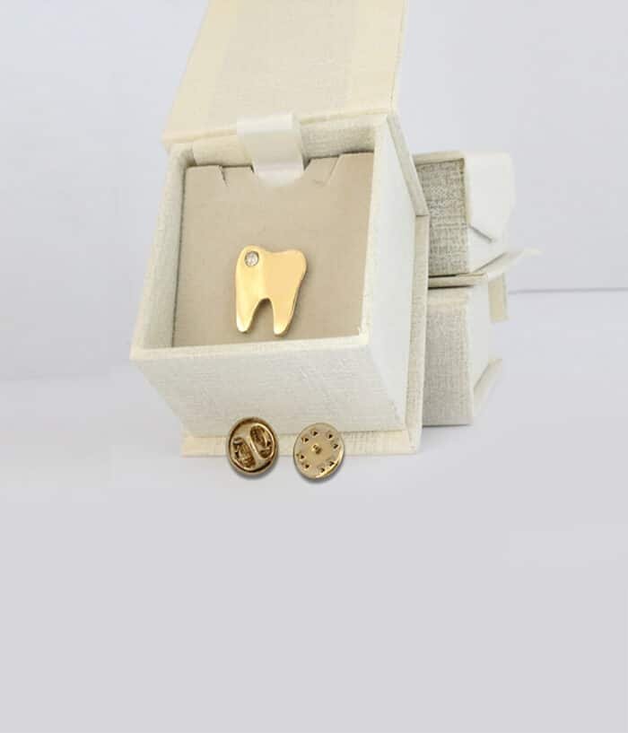 tooth brooch gold